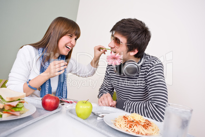 Student cafeteria - teenage couple having fun