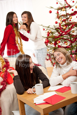 Four young women having fun on Christmas