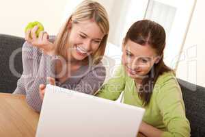 Student series - Two teenage students having fun with laptop