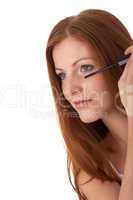 Body care series - Beautiful red hair woman applying mascara