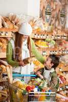 Grocery store shopping - Red hair woman with little boy