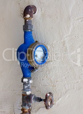 Old dirty water meter and rusting valve