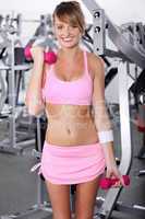 Portrait of strong woman lifting barbell