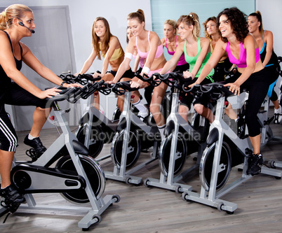 Group of people doing exercise on a bike