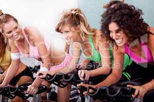 women at the gym doing cardio exercises