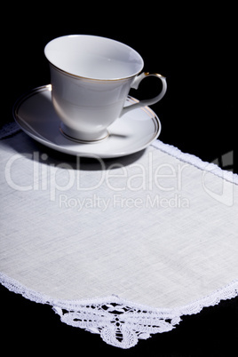 cup on white doily