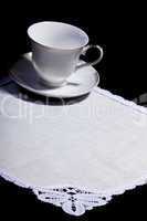cup on white doily