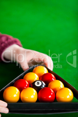 snooker player placing balls