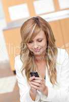 businesswoman sending a text message
