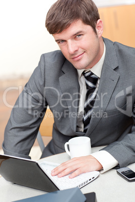 Busy businessman with a laptop