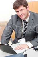 Busy businessman with a laptop