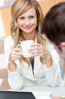 businesswoman holding a cup of coffee