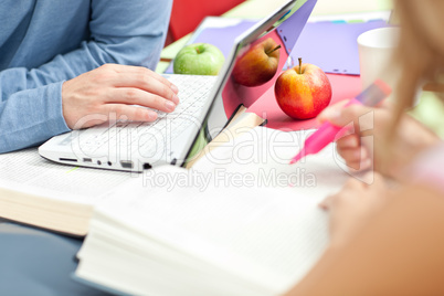 Close-up of two serious teenagers studying