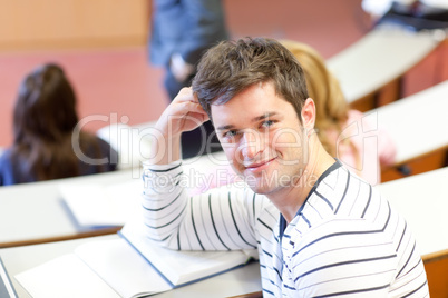 male student smiling at the camera