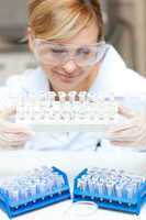 Caucasian female scientist holding samples