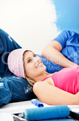 couple relaxing after painting a room