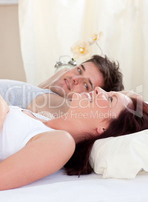 couple lying on bed