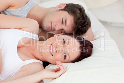 couple resting in bed together