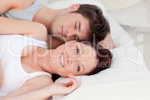 couple resting in bed together