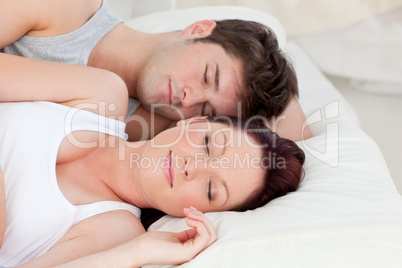 couple sleeping in bed together