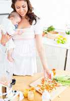 mother with baby in a kitchen