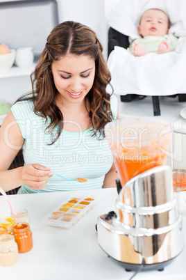 mother preparing food for her baby
