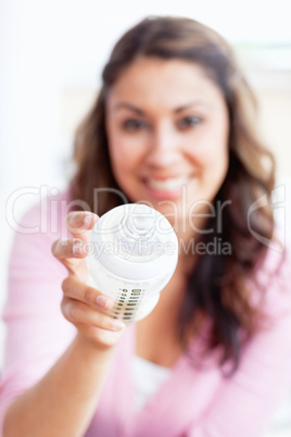 young mother holding a feeding-bottle