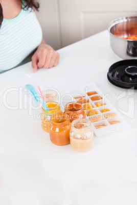 mother preparing food for her baby