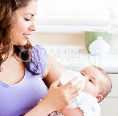 mother feeding her baby