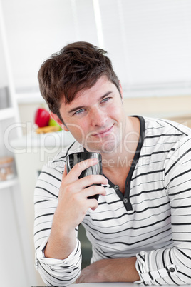 man drinking coffee in the kitchen man drinking coffee in the kitchen