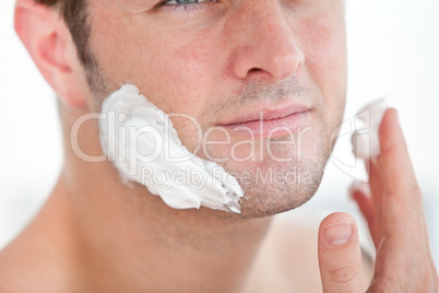 man preparing to shave in the bathroom