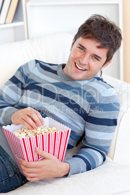 man eating popcorn