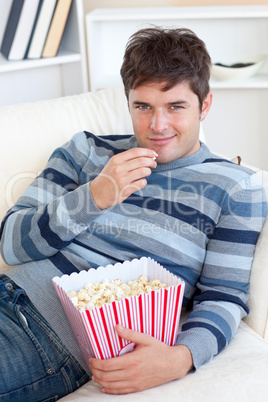 man eating popcorn