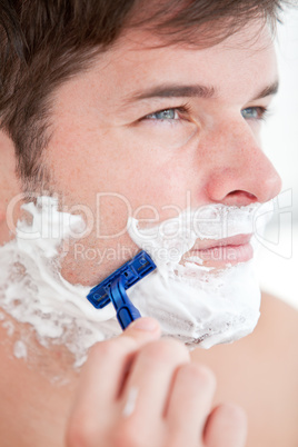 man shaving in the bathroom