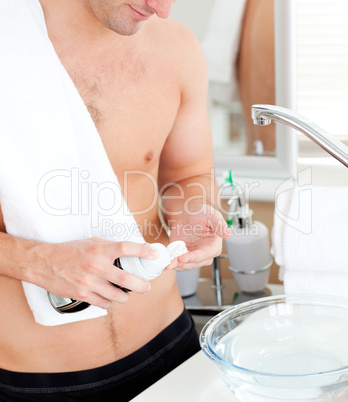 man preparing to shave in the bathroo