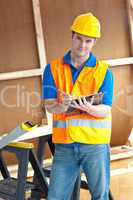 Confident male worker holding a clipboard