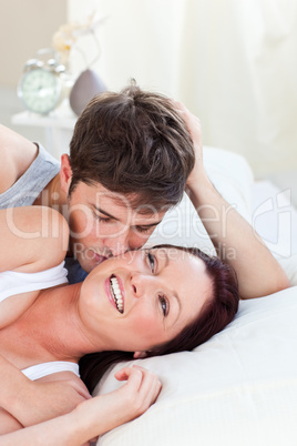 couple lying on bed in the bedroom
