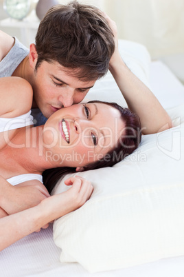 couple lying on bed in the bedroom