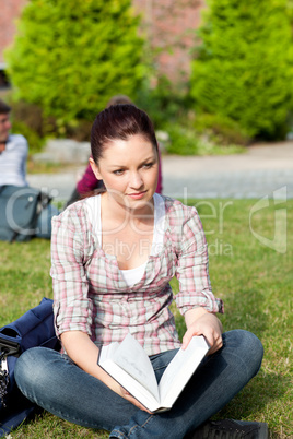 female student reading a book