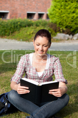 female student reading a book