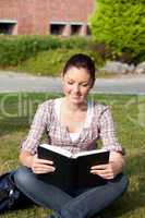 female student reading a book