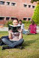 female student reading a book