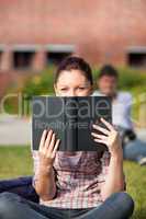 female student reading a book