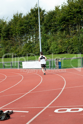 Sporty male sprinter training