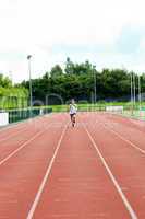 Athletic male sprinter training