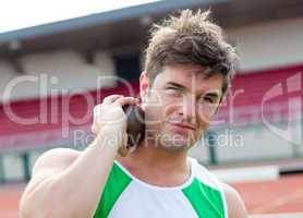 male athlete preparing to throw weight