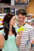 Delighted couple buying products