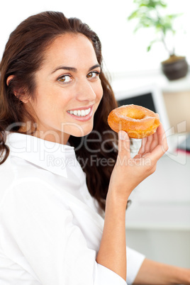 businesswoman holding a doughnut