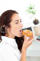 businesswoman eating a doughnut