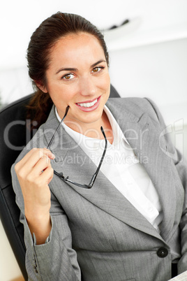 businesswoman holding glasses